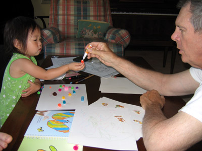 Grandpa Calvin plays glue & pom-poms with granddaughters